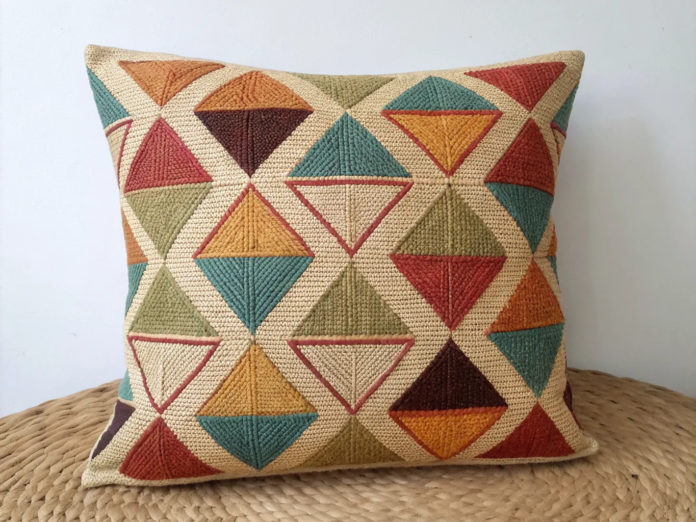 Hand-woven cushion with geometric pattern